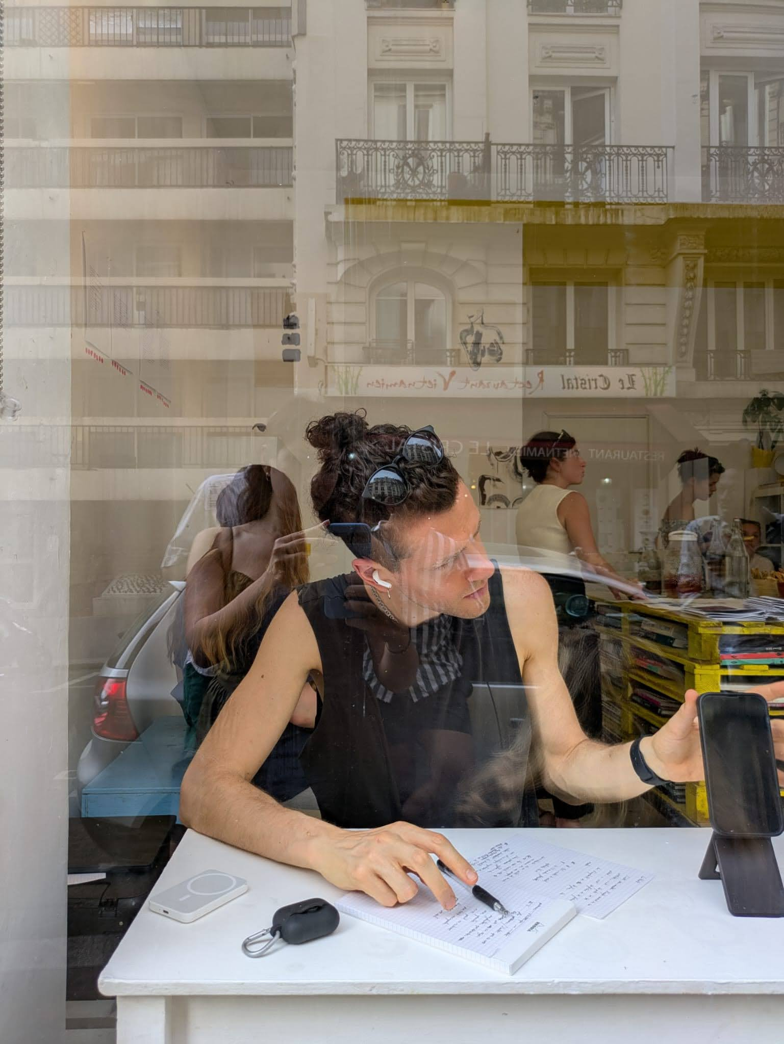 Audience reading printed poems during the performance