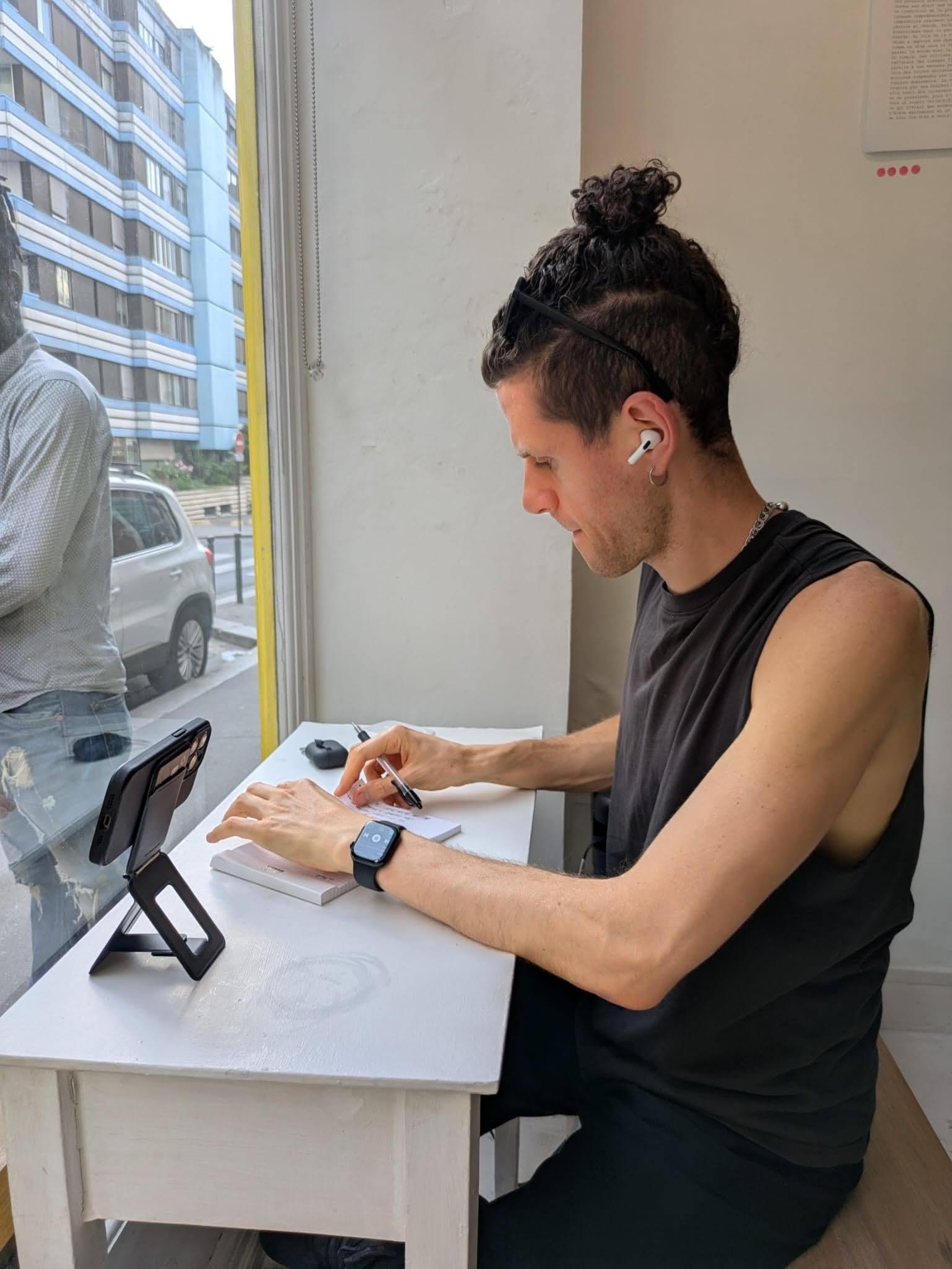 Close-up of printed poems with pink voting dots
