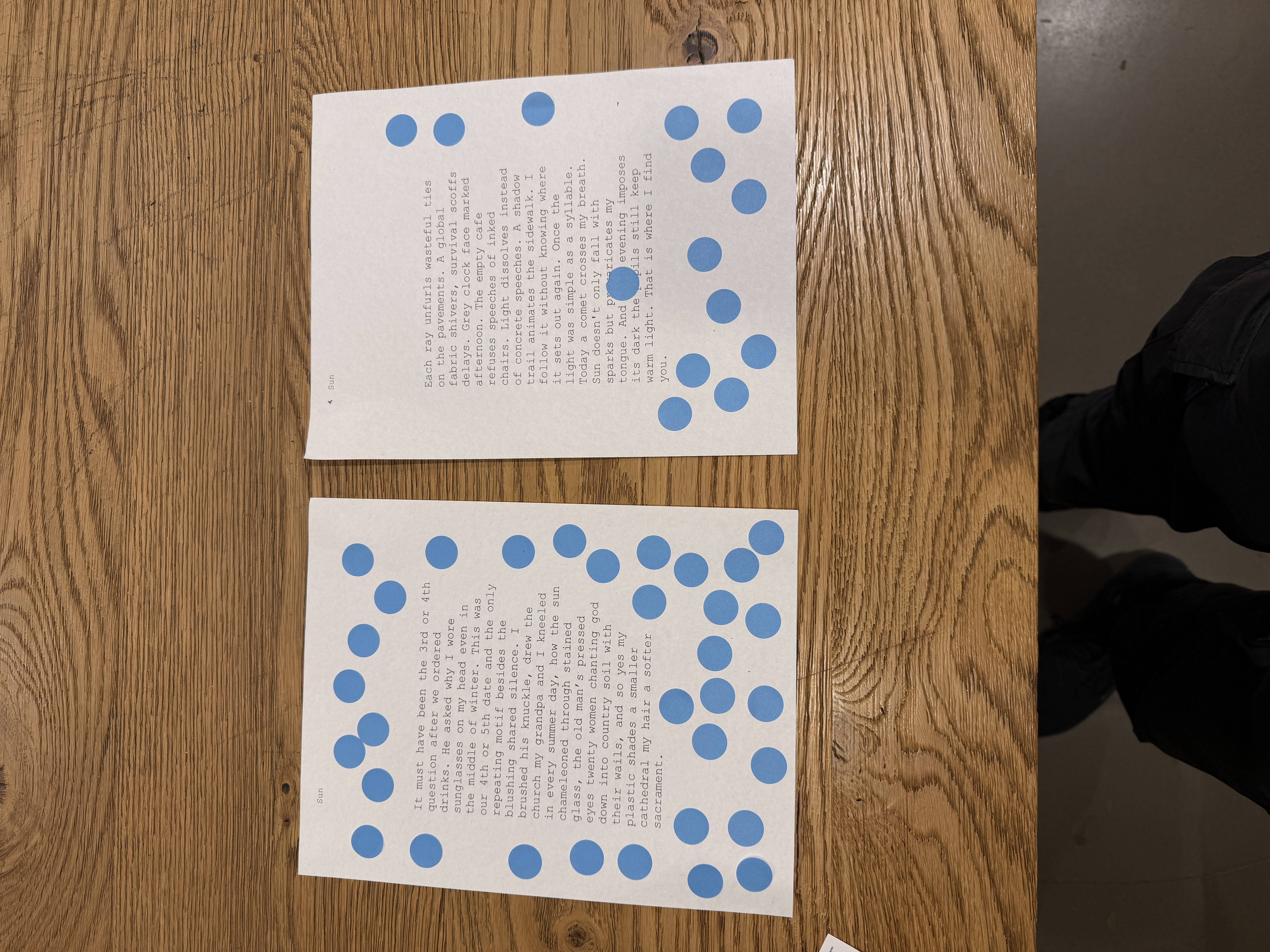 Printed poems covered in blue voting stickers