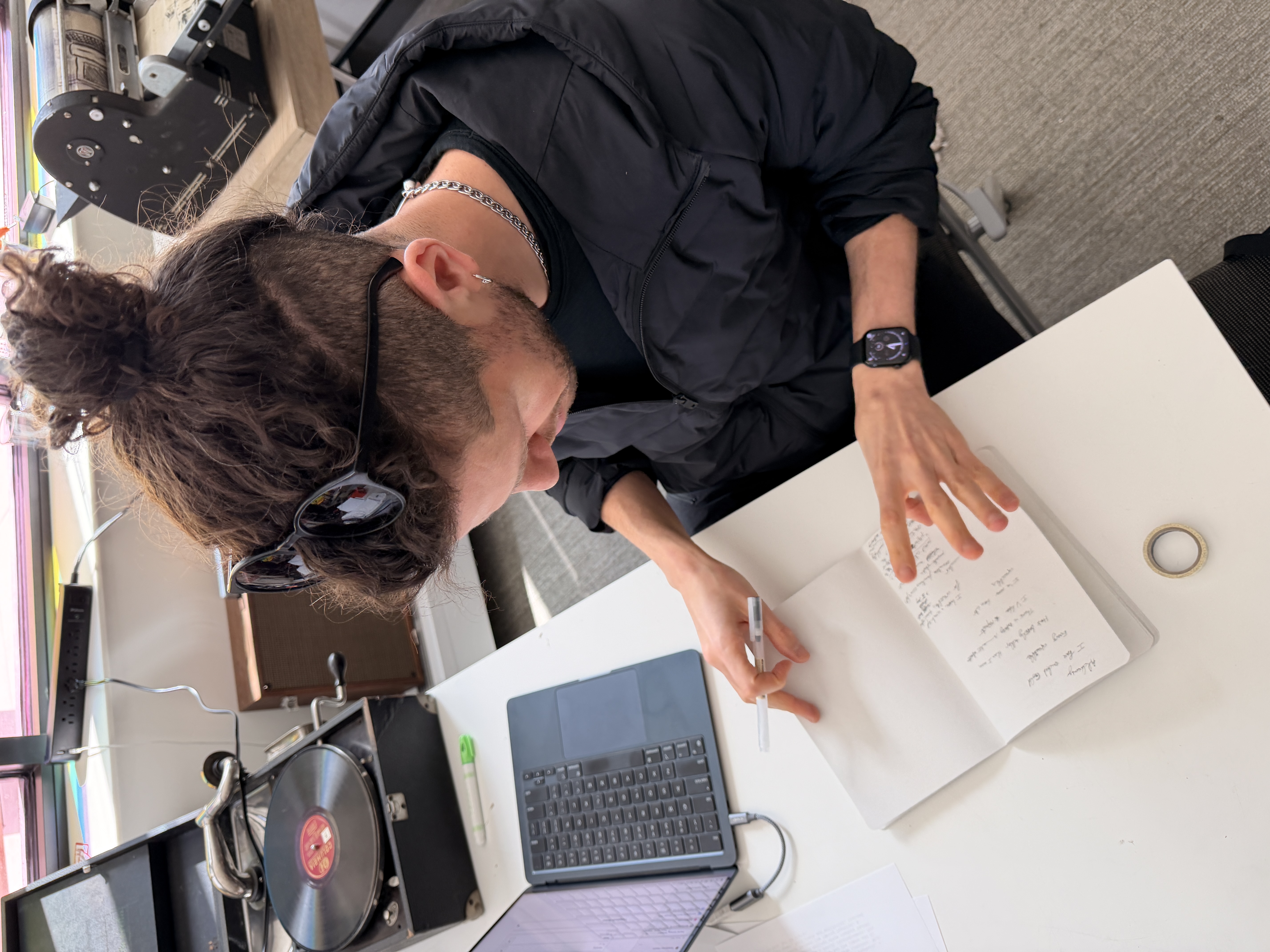 The poet writing among vintage machines at the Media Archaeology Lab