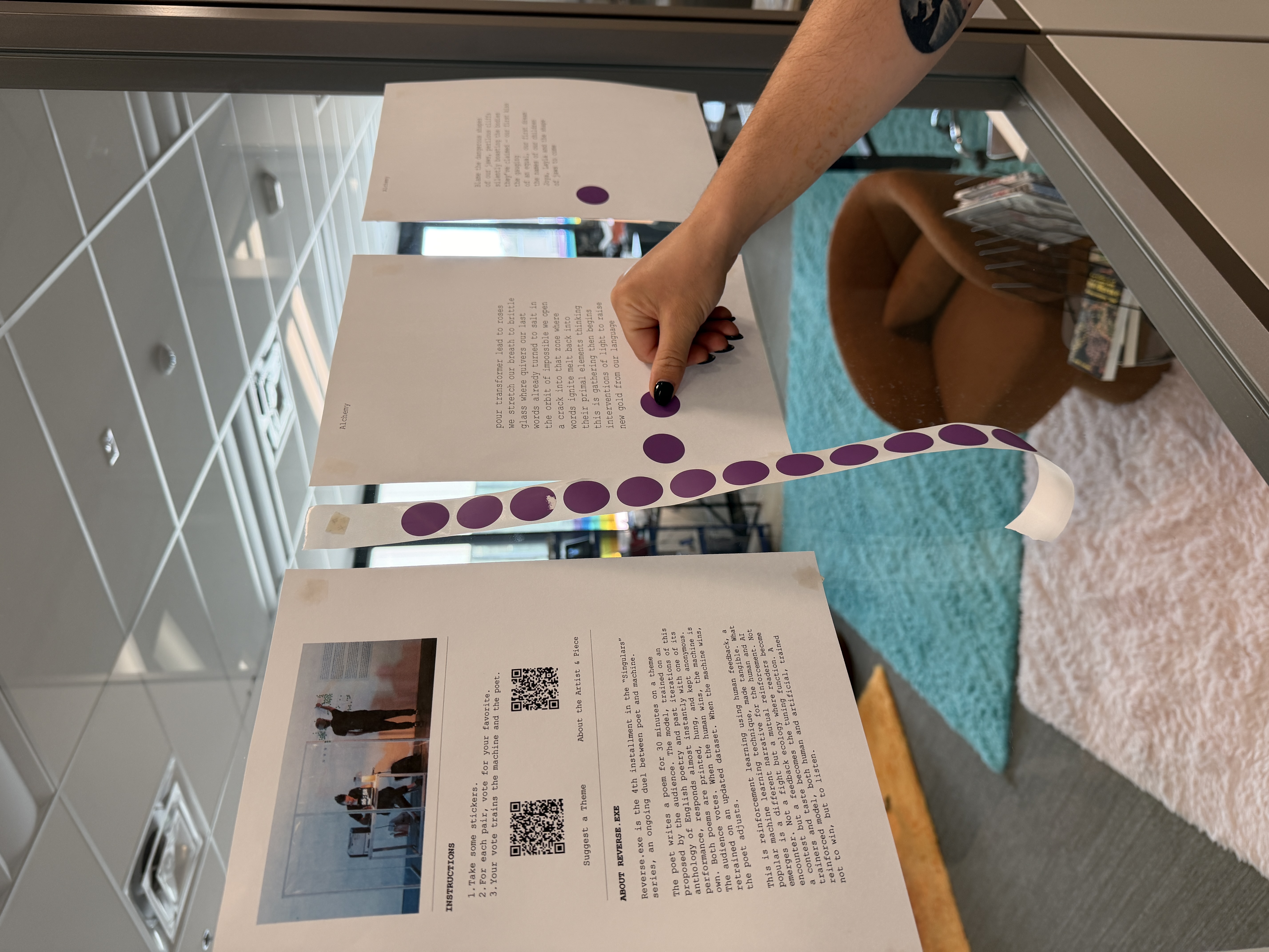 Printed poems accumulating with purple voting stickers at the lab